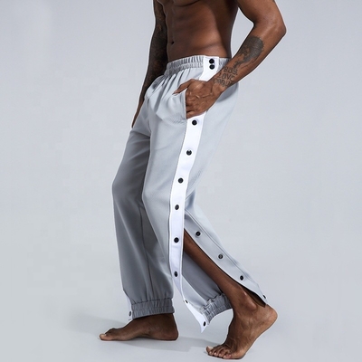 comprar Pantalones de baloncesto activo de poliéster con botón lateral y traje para corredores online manufacture